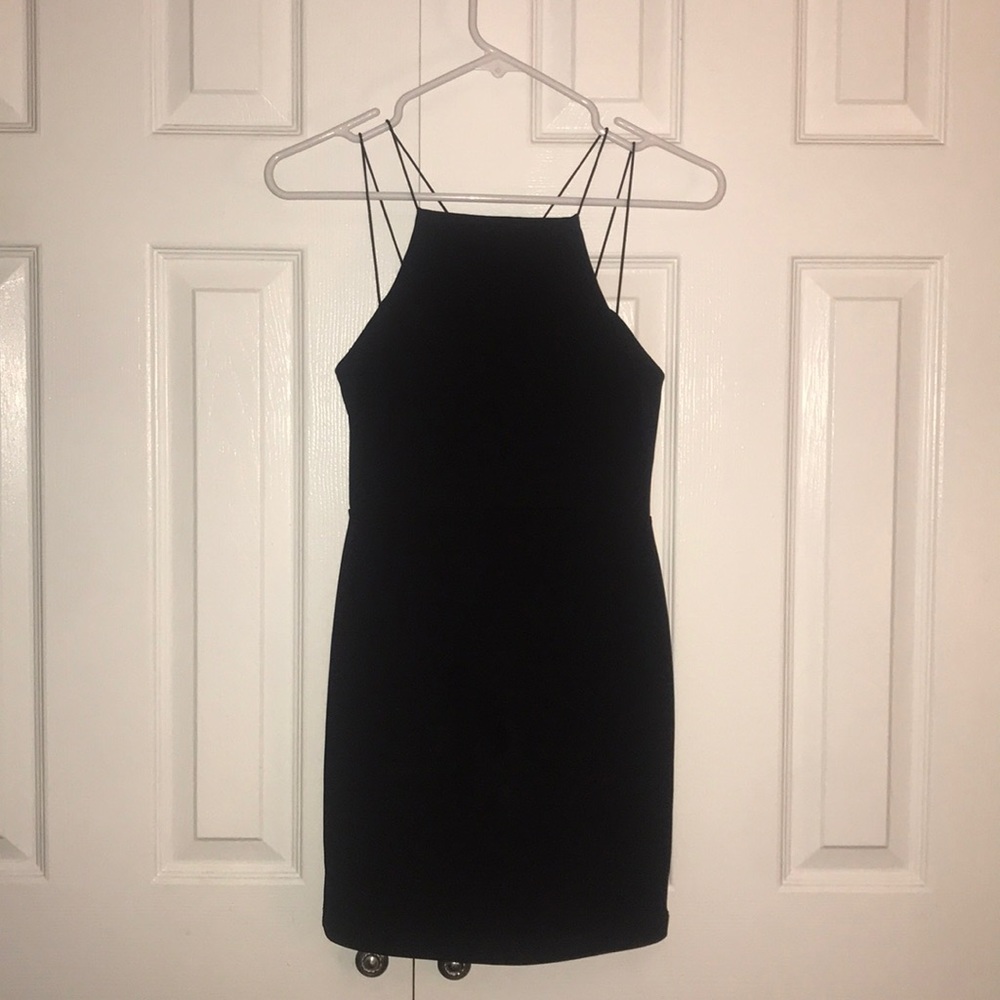 Black dress with straps in the back.